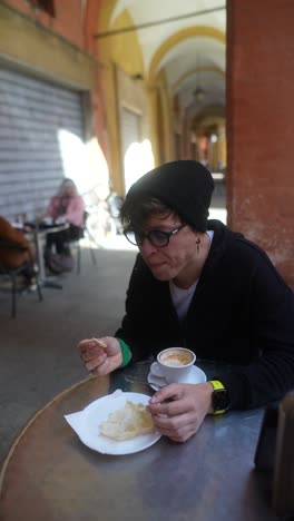 enjoying a coffee and pastry in a florence street cafe