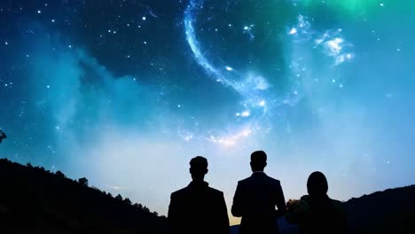 siluetas de personas mirando hacia un impresionante cielo nocturno lleno de estrellas y una galaxia