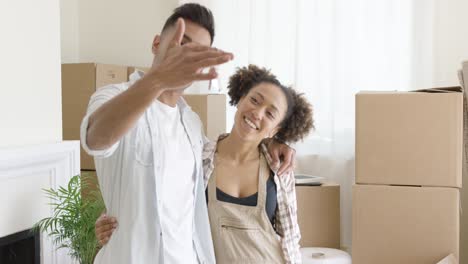 Smiling-young-man-holding-the-keys-to-a-new-home