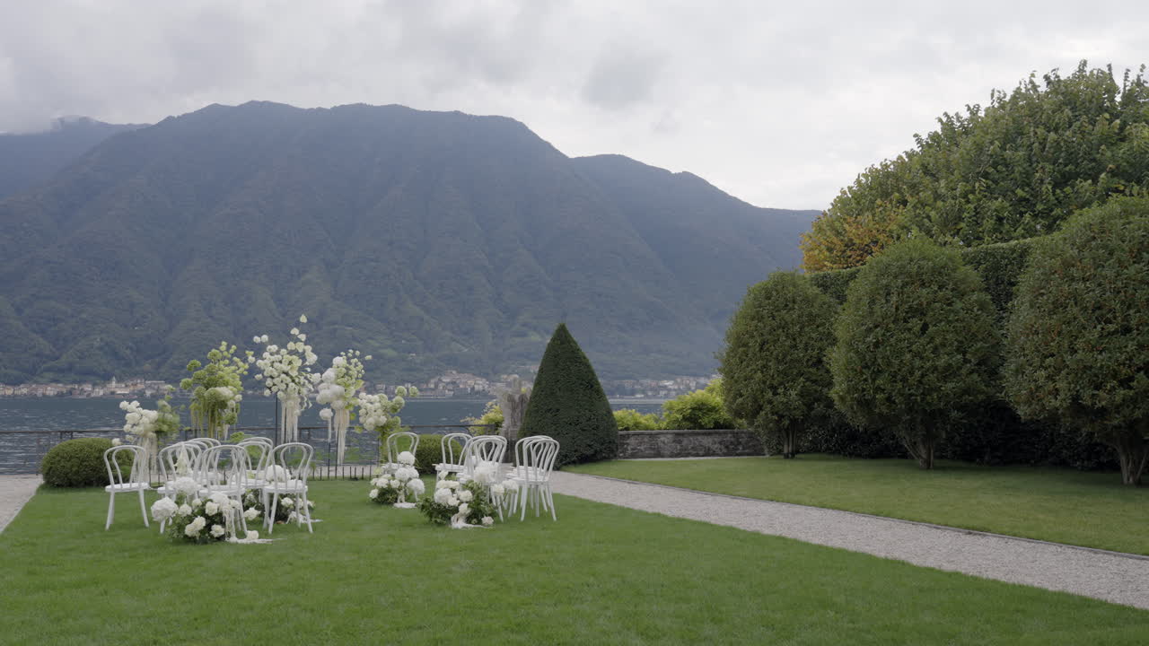 Elegant Outdoor Wedding Ceremony by the Lake with Mountain View