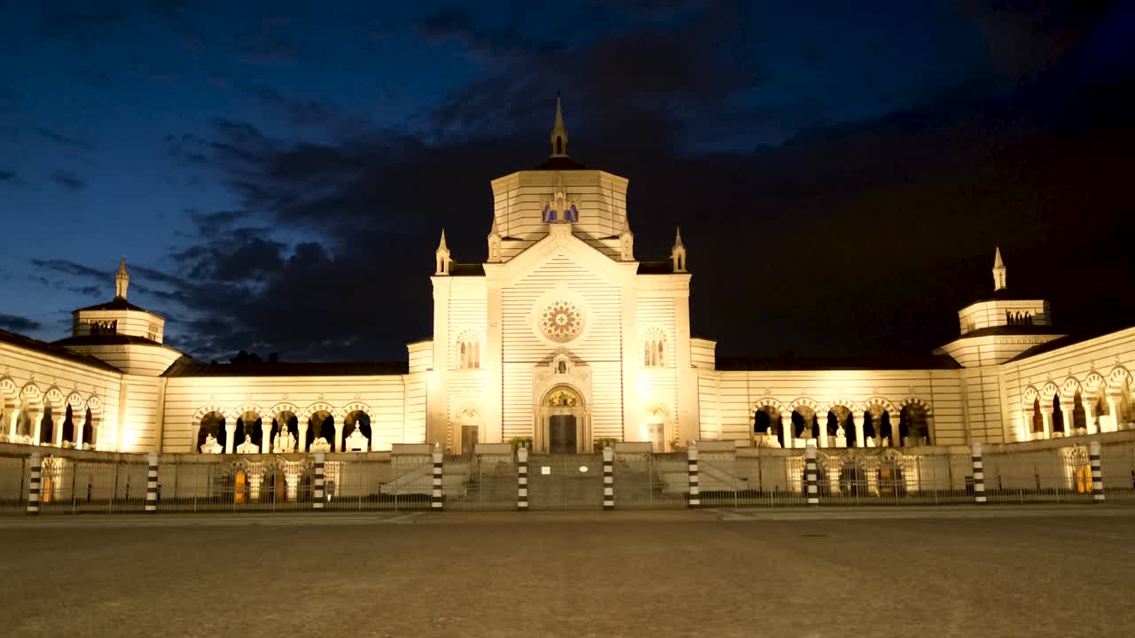 Static Wide Shot of Monumentale Cemetary Milan Under Dark Blue Cloudy Sky
