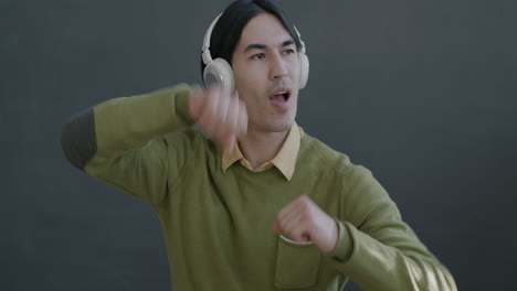 man listening to music and dancing