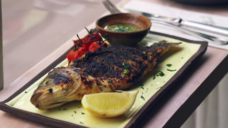 chargrilled fish, roasted tomatoes and dressing, rack focus