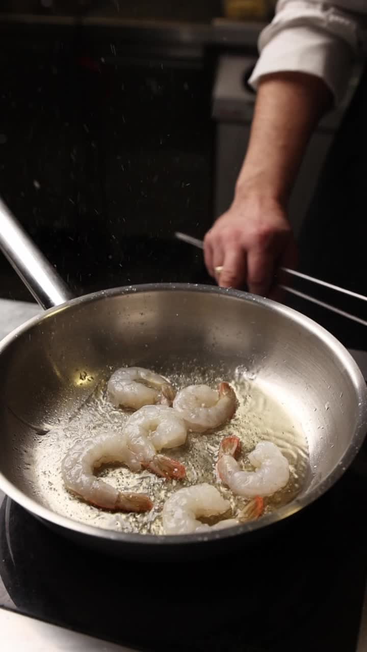 Shrimp Frying in a Hot Pan in a Professional Kitchen