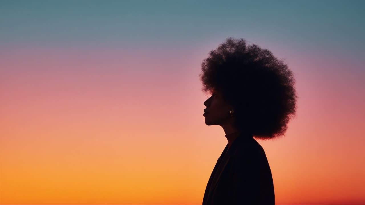 Silhouette of a Person Against a Stunning Gradient Sunset Sky, Capturing the Essence of Serenity and Reflection in a Moment of Tranquility