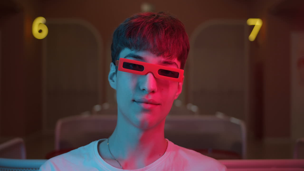 Man with Red Glasses in Neon Lights