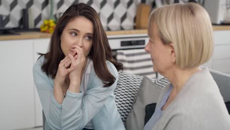 handheld video of mother comforting upset adult daughter