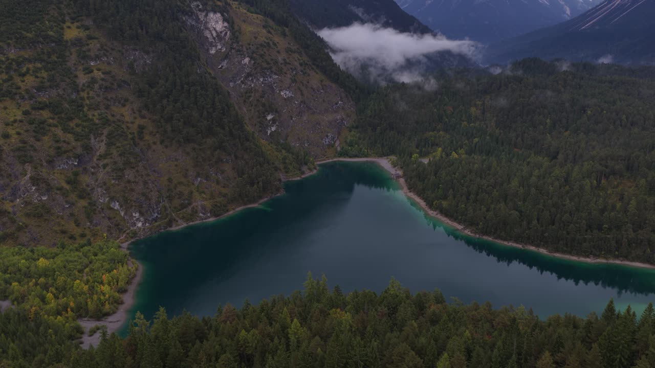 mountain lake, Italian alps, misty day. Aerial drone video