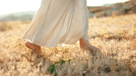 woman bare foot in a field