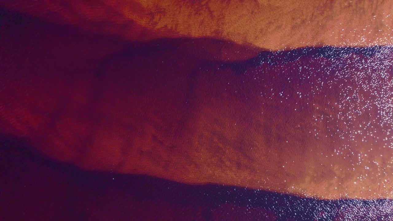 Aerial Abstract of Vibrant Red and Orange Water Surface