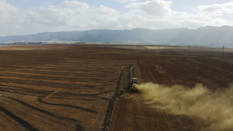 4k-drone-footage-of-a-tractor-ploughing-a-field