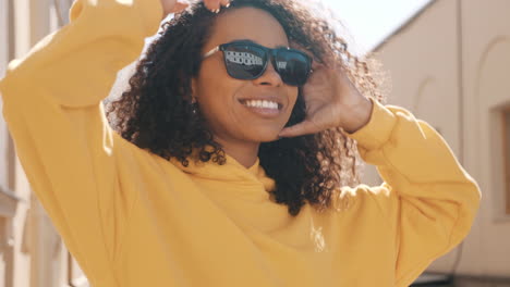 happy woman in yellow hoodie