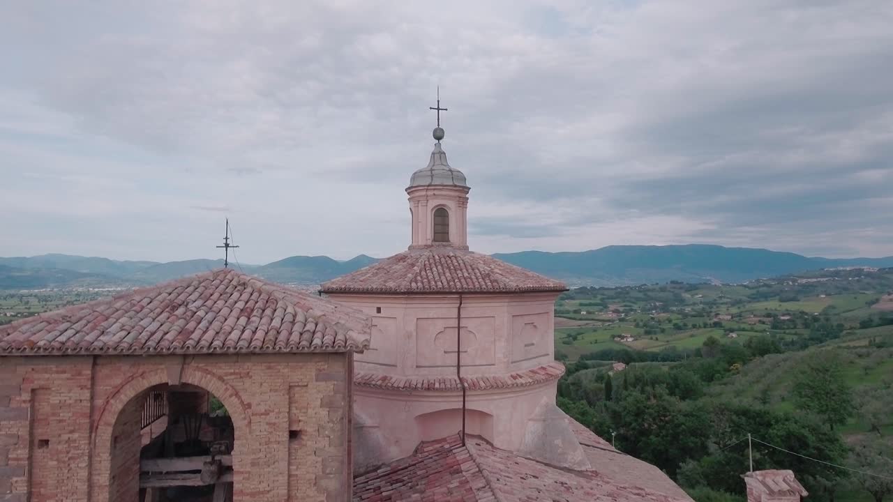 Aerial Drone shot Crane Down onto Church from Countryisde in Umbria, Italy
