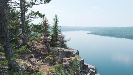 beautiful cliff vista overlooking a calm lake in the boundary waters canoe area wilderness