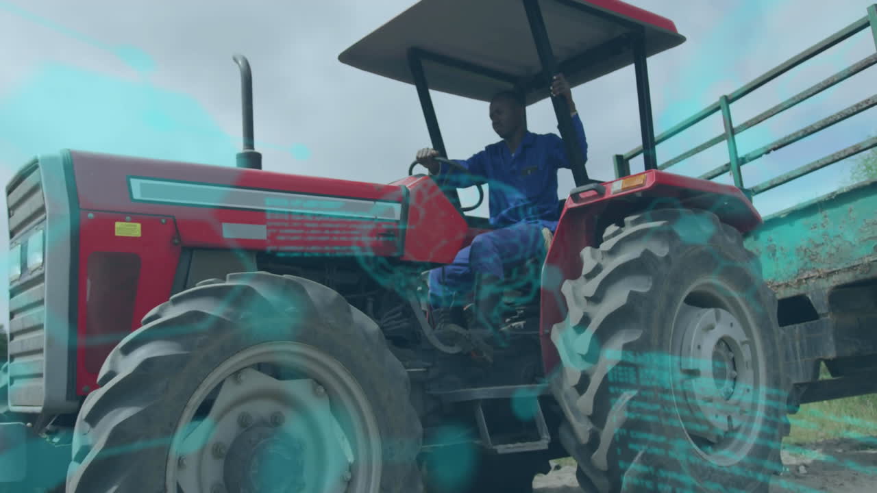Farm technician operating tractor under canopy, showing floating holographic code overlays