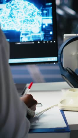 vertical video female technician in data center answers telephone call, assisting users with ai