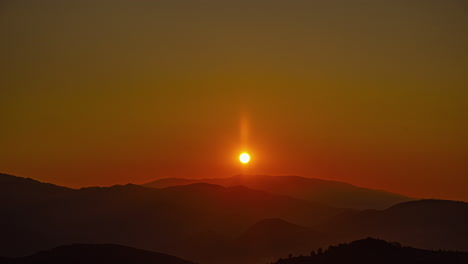 brilliant sunrise in timelapse over mountain range during morning time