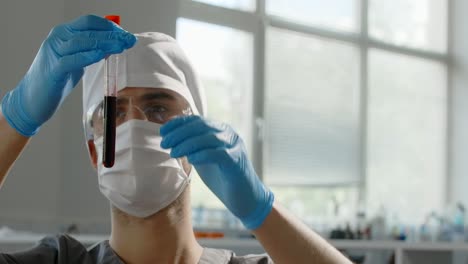 scientist examining a sample in a test tube