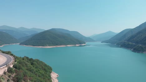 aerial view from drone of a river amongst mountains and the beautiful nature in georgia