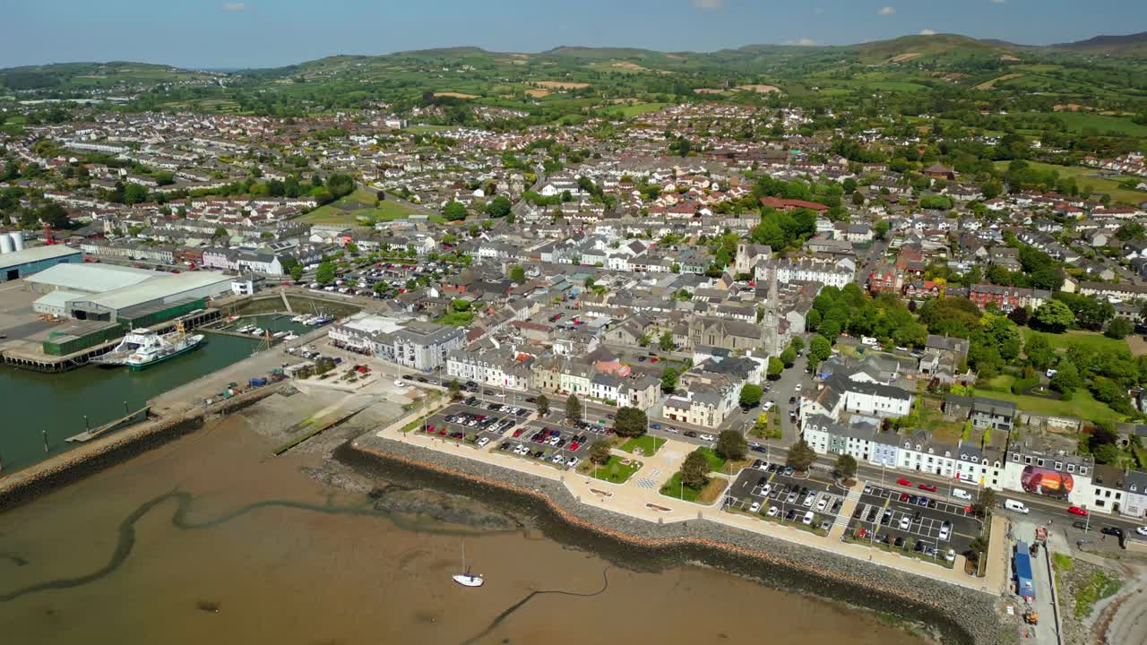 Slow, advancing aerial video of Warrenpoint, County Down, Northern Ireland, UK on a bright and sunny day. Filmed in 4K, 60FPS and with Rec709 color.