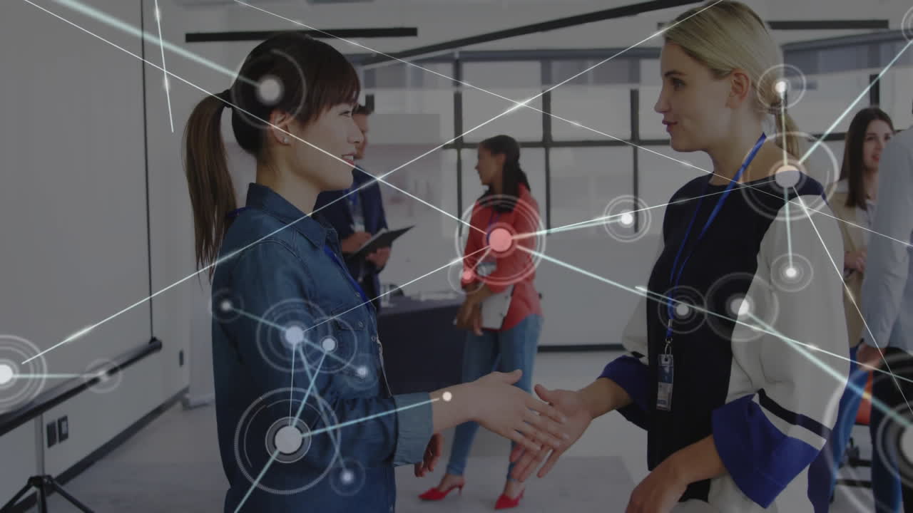Shaking hands, business professionals with network connections animation overlay in office