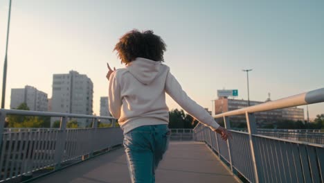 black woman dancing on the bridge