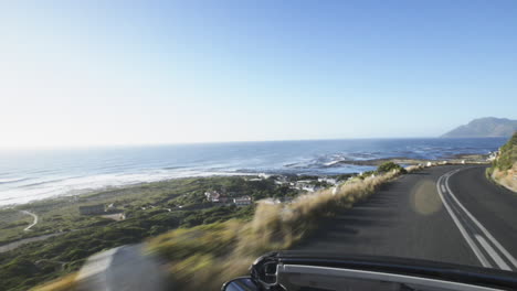 Couple-driving-convertible-car-cabriolet-cape-town-south-africa-steadicam-shot