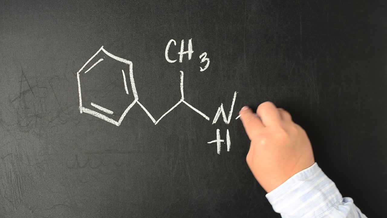 Chemical formula of Methamphetamine. We write with chalk on a board