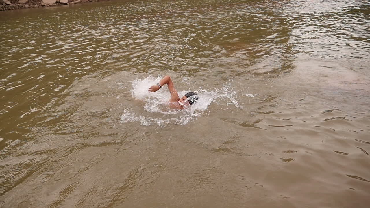 Children Swimming in a River