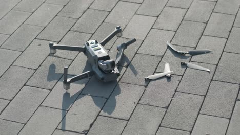 crashed drone lays on the ground and damaged