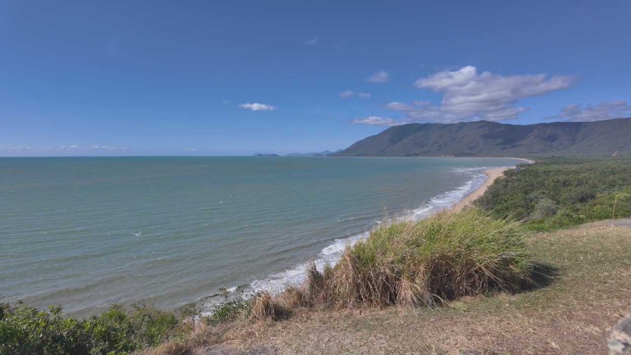 4K video of a beautiful curved beach in North Queensland in Australia