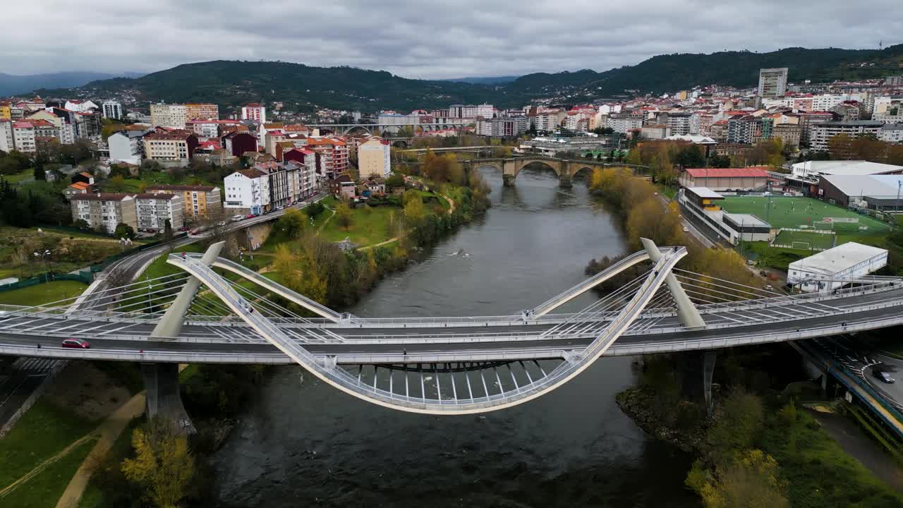 Two bridges in Ourense Spain, Puente del Milenio and Puente Romana criss river mi&ntilde;o