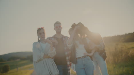 Smiling-Friends-Posing-Together-Against-Sky