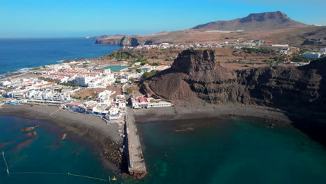 Aerial-view-in-a-circle-over-the-Las-Nieves-rock-and-the-wonderful-Las-Nieves-port-in-the-town-of-Agaete