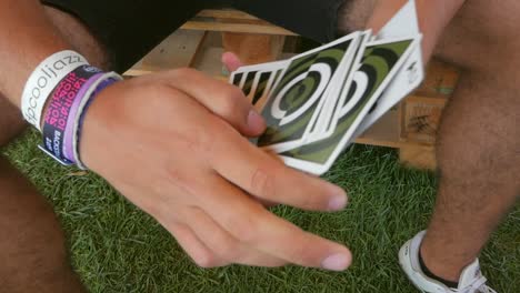 portugal - man doing card tricks with his hands in slow motion - close-up shot