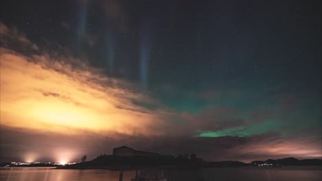 enchanting northern lights over a small cstle in norway