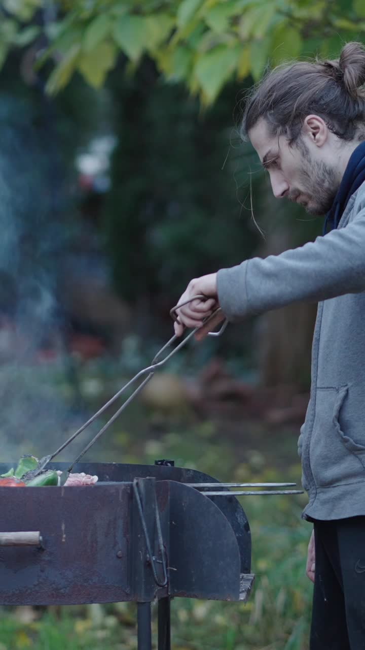 Man grilling food outdoors