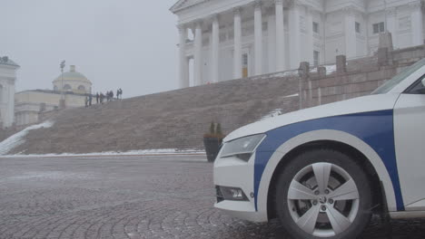 police car guard the stairs of helsinki cathedral