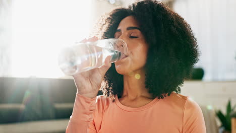 woman drinking a glass of water