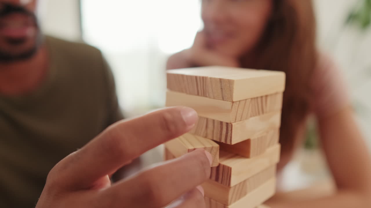 Couple Playing Jenga at Home