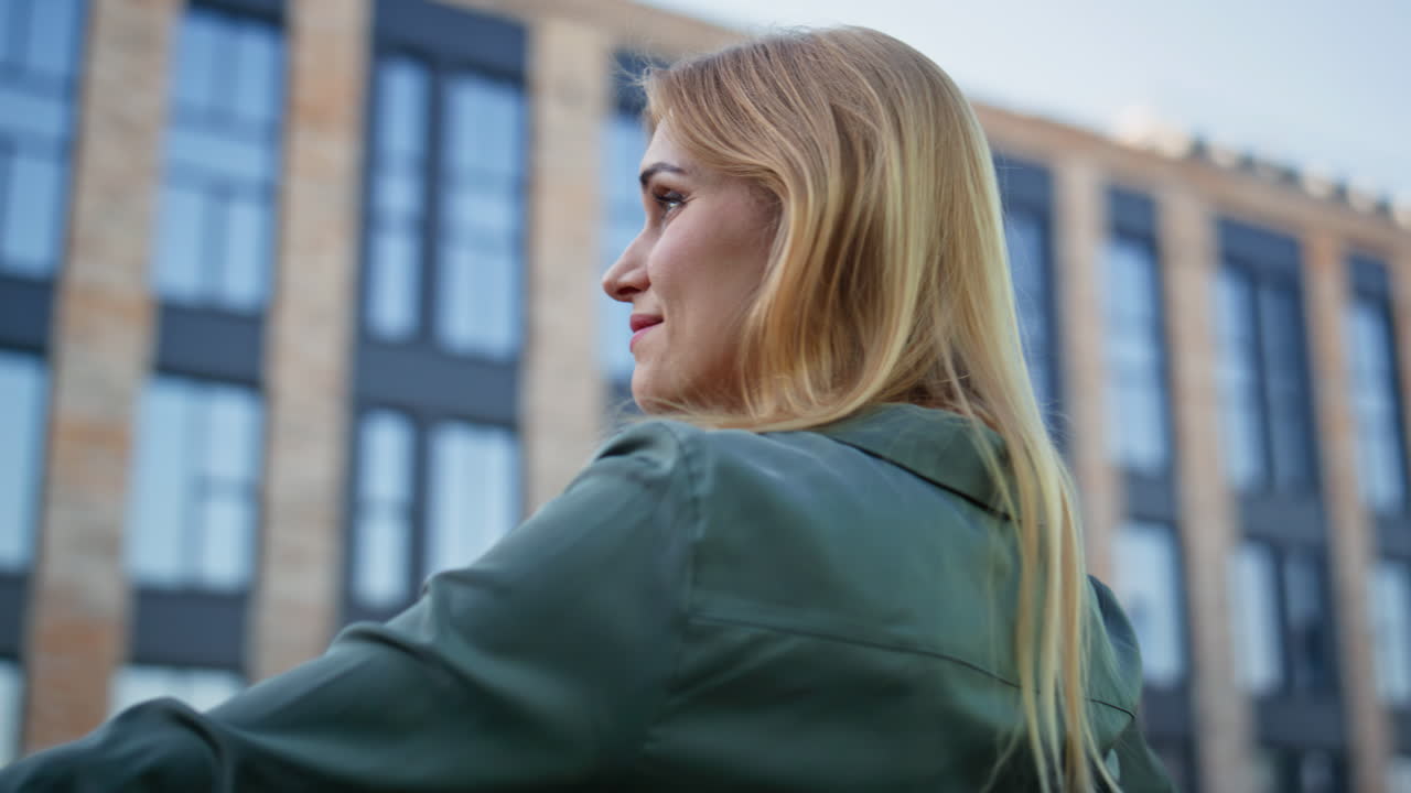 Closeup blonde lady looking views downtown. Creative smiling manager pondering