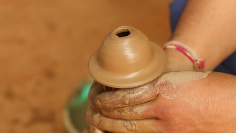 potter at work makes ceramic dishes. india, rajasthan.