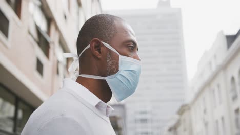 african american man on the go wearing coronavirus covid19 mask