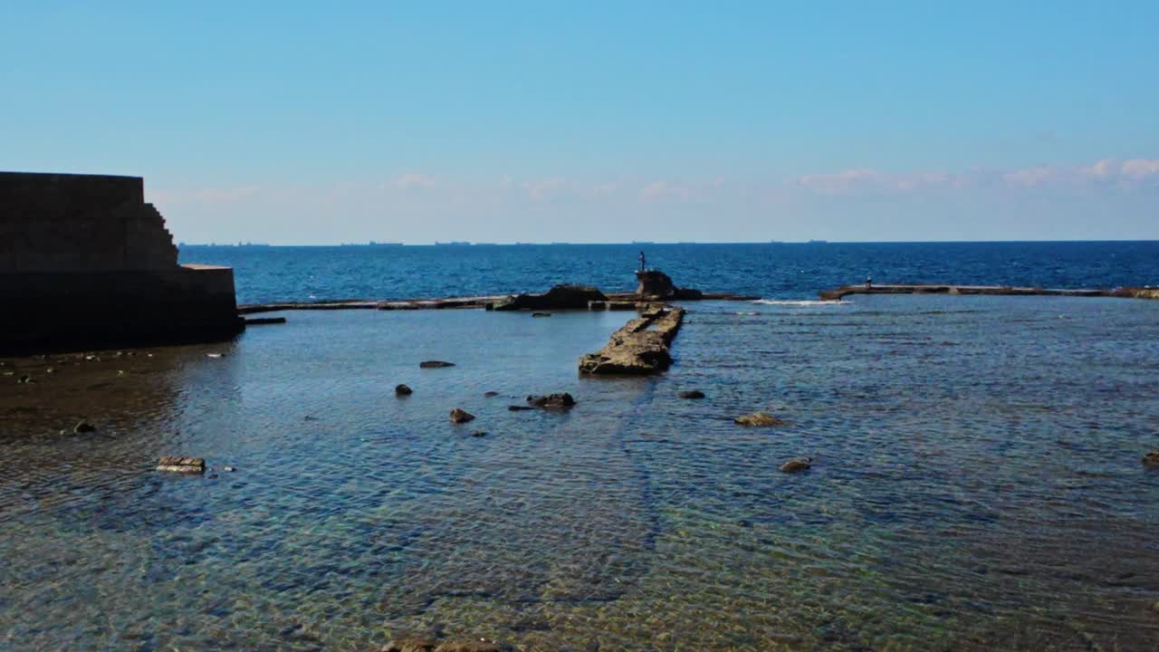 Akko old city coastline with clear mediterranean water