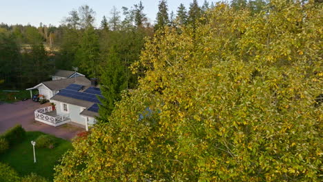 aerial view of a house with solar panels in a suburban setting