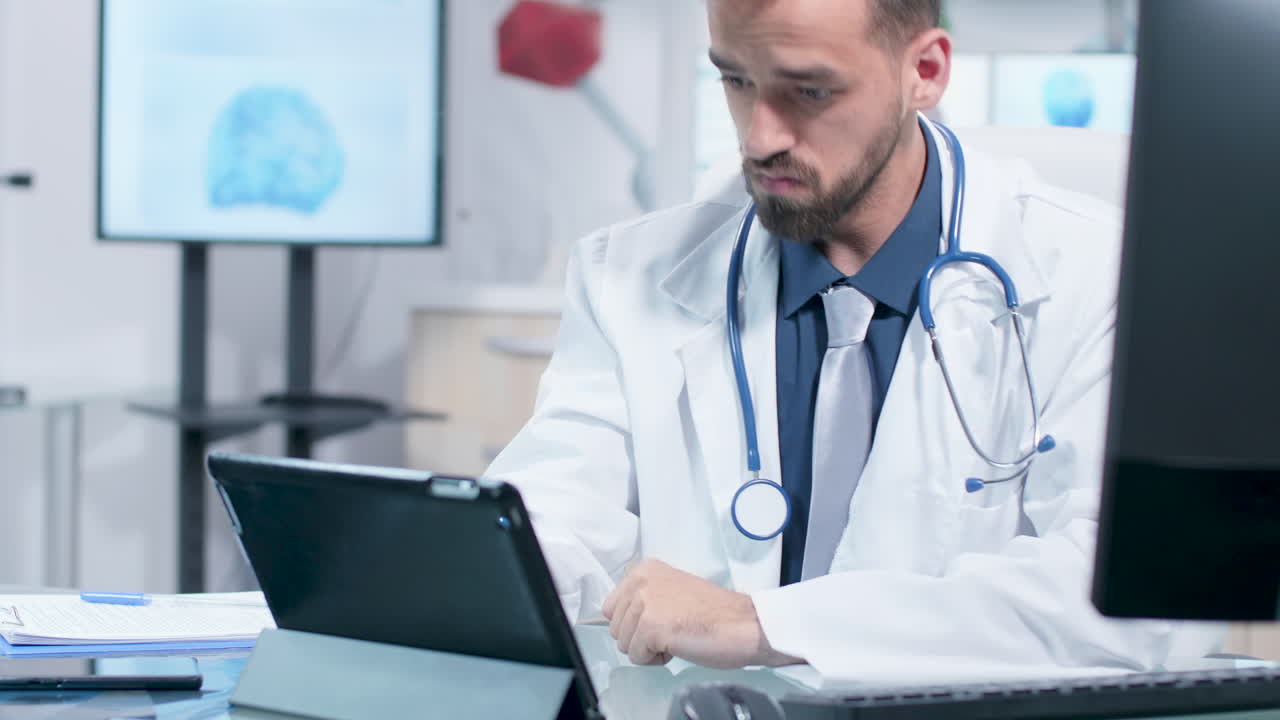 Doctor working with tablet and medical data in office