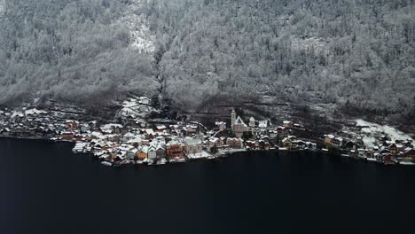 Footage-filmed-with-a-drone-over-a-lake-by-a-town-called-Hallstatt-in-Austria-in-Europe