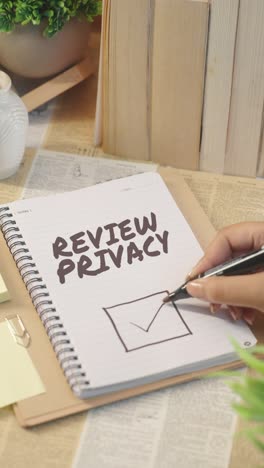 vertical video of ticking off review privacy from checklist