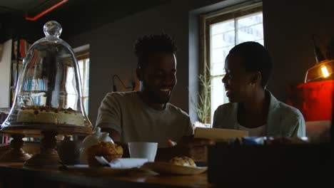 couple looking at menu card in cafe 4k