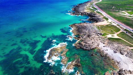 aerial-view-of-rugged-coast-,-blue-waves,-4k